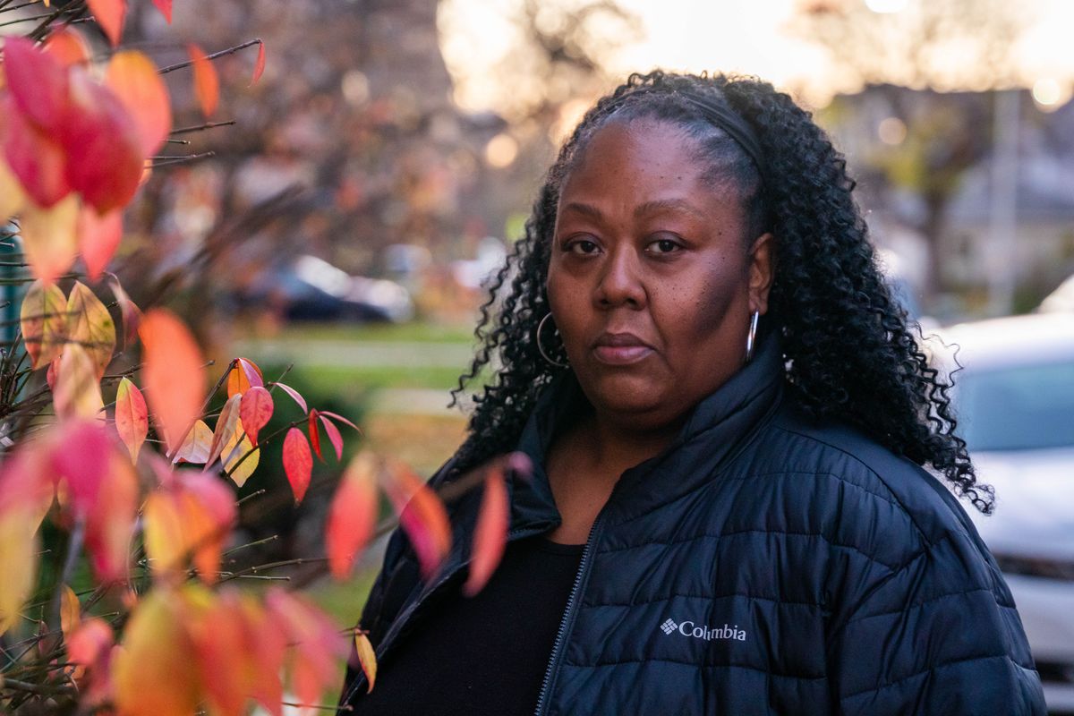 Tiffany Moore is seen in a shoulder-up photo, standing outside near colorful fall foliage.  The Forest Park woman turned to an installment loan with an interest rate of just under 36% during the pandemic.  She says she almost immediately realized it was a bad deal.